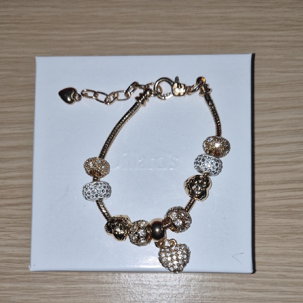 Elegant Gold and Silver Charm Bracelet